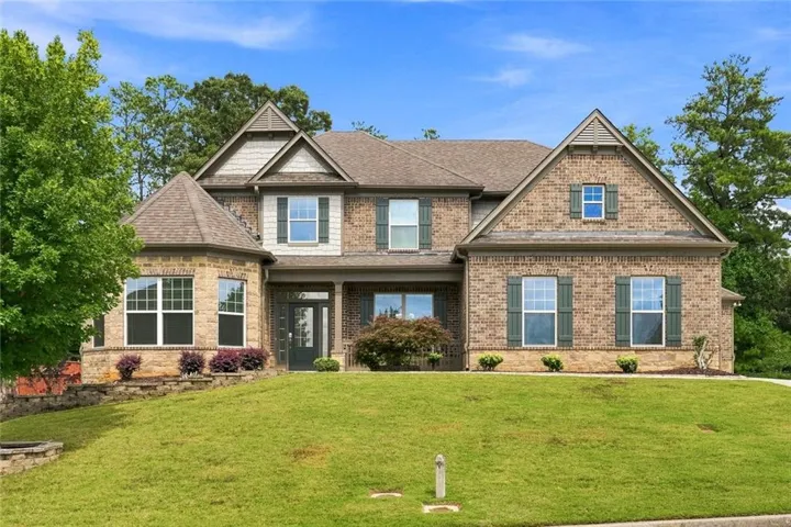 Brick exterior with multiple gables and dormers