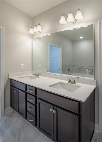 Tray ceiling with crown molding and ceiling fan, two windows with blinds, and neutral carpet