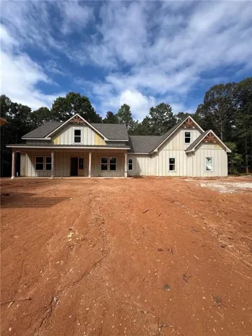 Farmhouse-style exterior with vertical siding