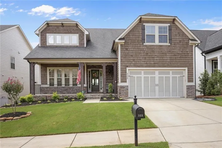 Craftsman-style exterior with shake siding and stone accents