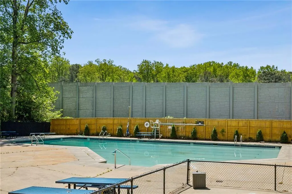 Community pool with a patio area.