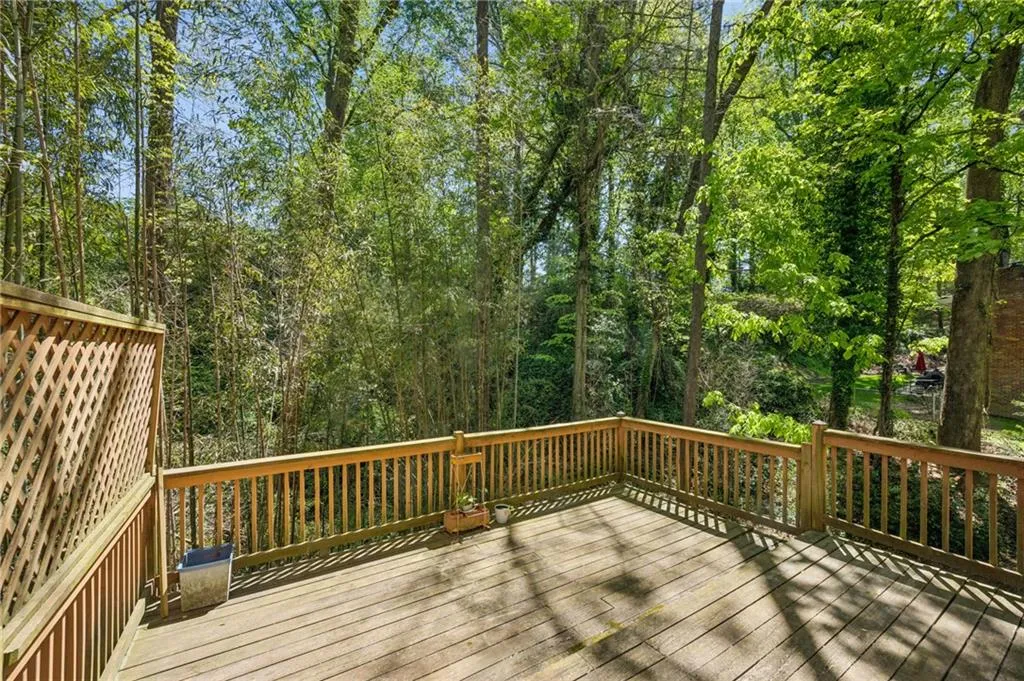 View of sunny deck off of the back of the house.