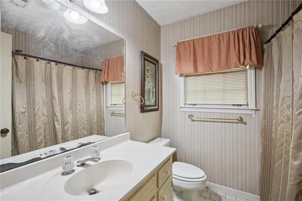 Second floor hall Bath with vanity, and shower/tub combo.