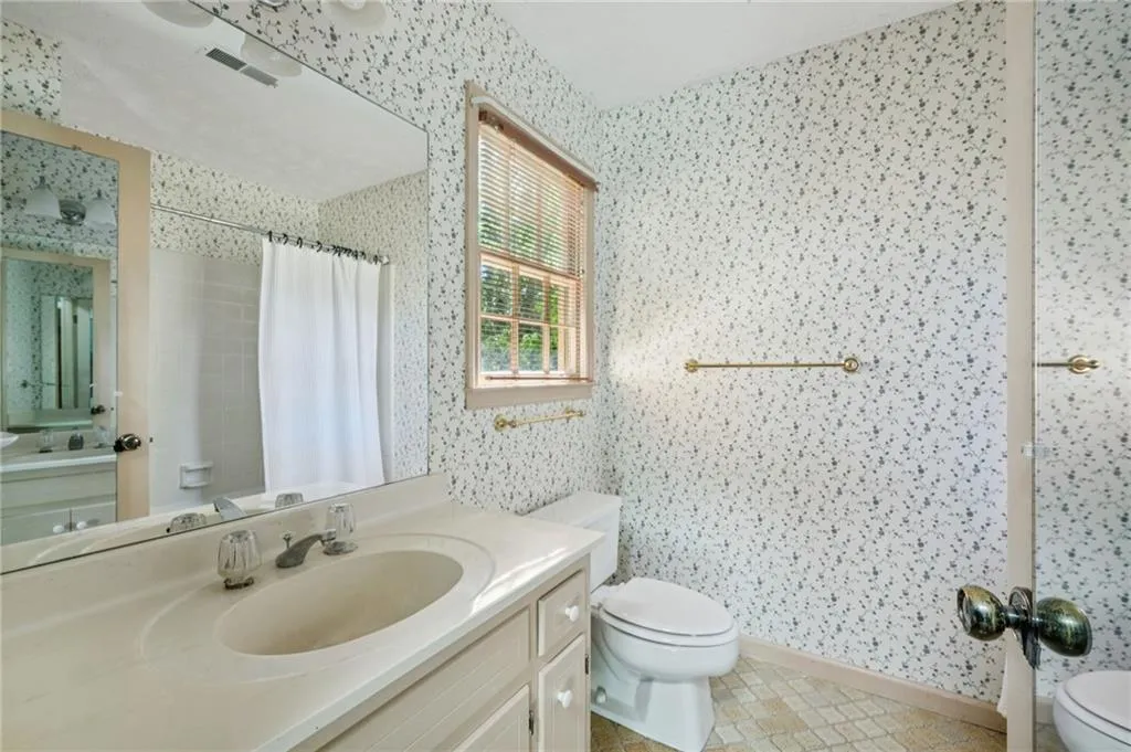 This whole area could be opened up for a glorious primary bath with amply closeting already in place.