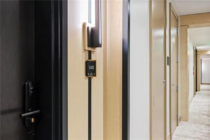 Modern entry door with dark finish and keycard access