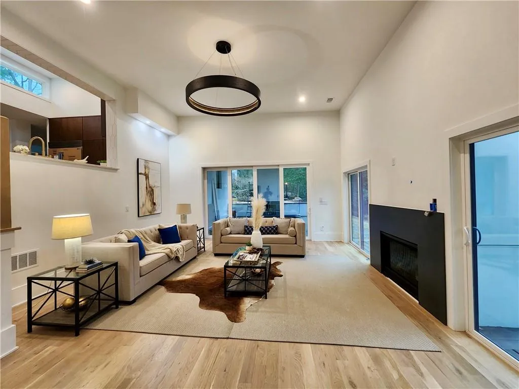 Step down from the kitchen into this grand 14 foot tall ceiling, Great Room.