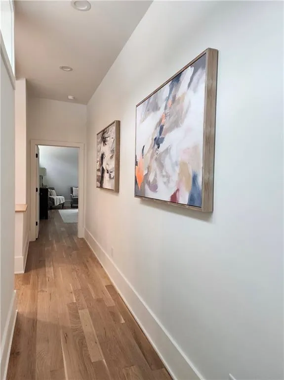 Long hall on upper level with lots of light for a fabulous Gallery wall