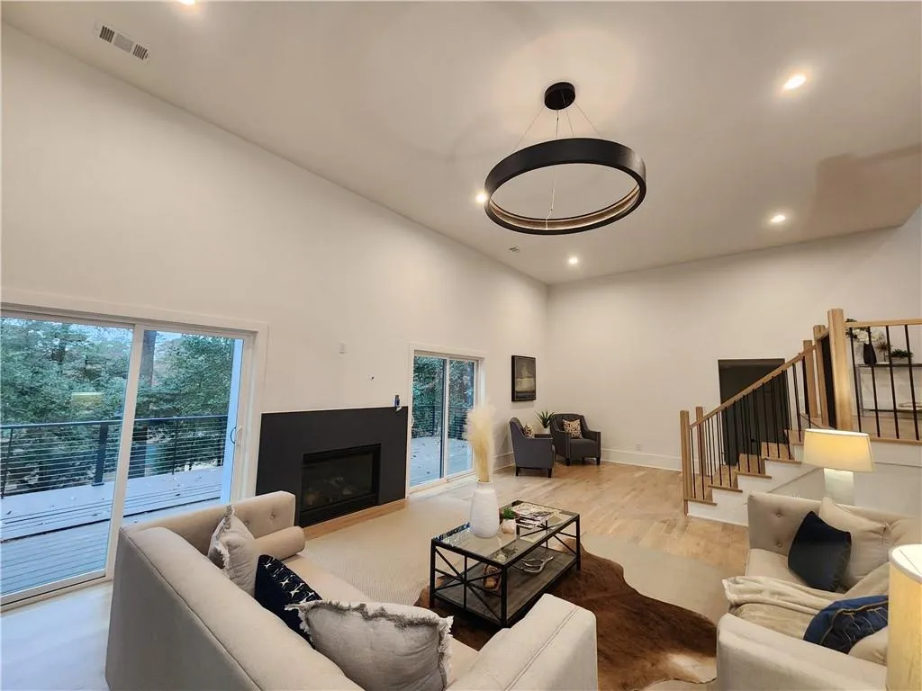 Fireplace not completed yet, Lots of sliding doors to the trex deck and large covered patio with fireplace