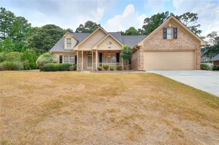 Brick and siding exterior with a covered porch