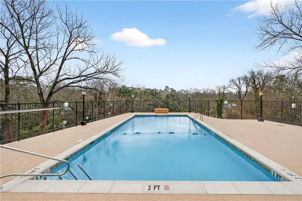 Community pool featuring a patio area