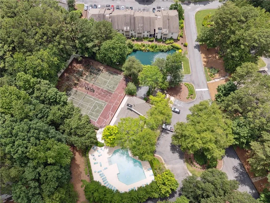 Aerial view of a nearby body of water and a pool