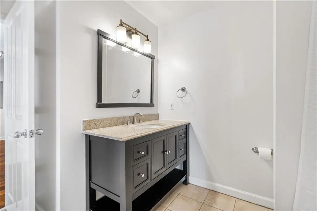 Bathroom featuring vanity and light tile patterned floors