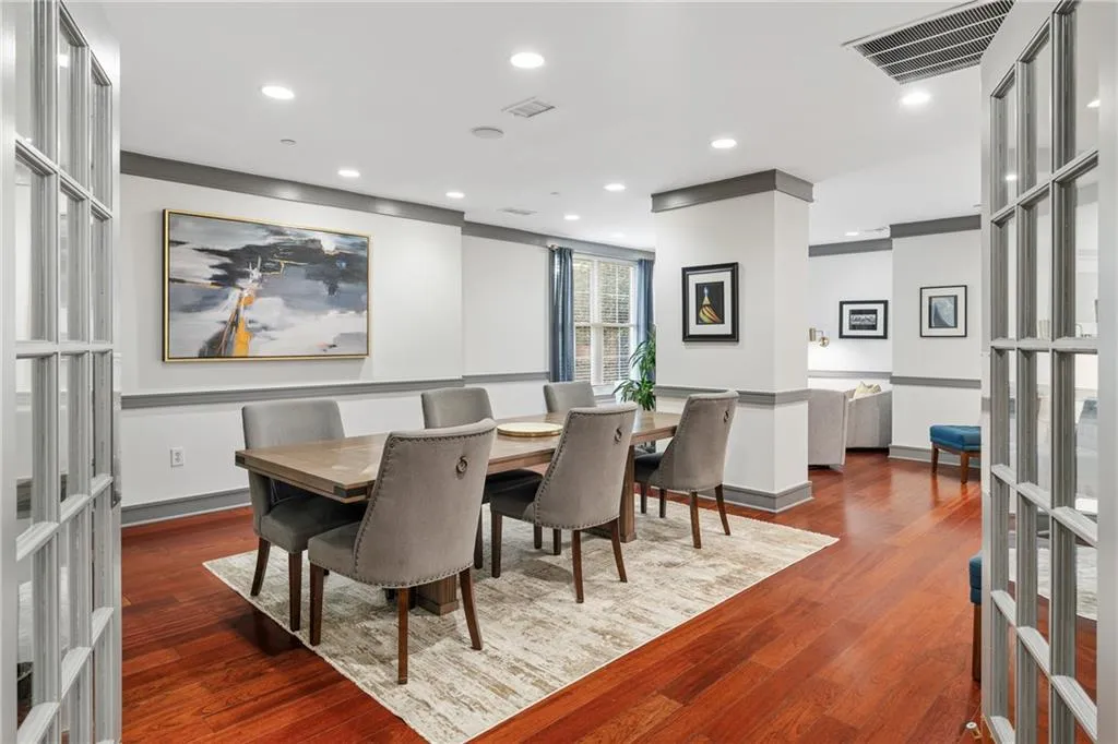 Dining room with french doors, recessed lighting, and dark wood finished floors