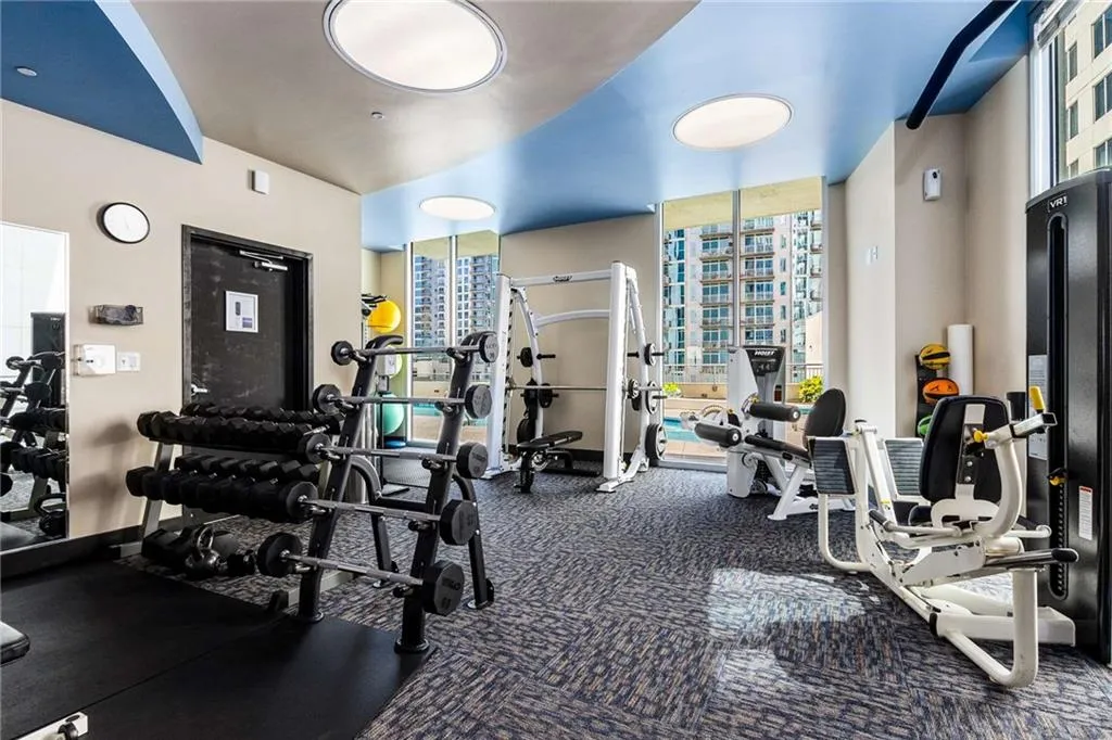 Exercise room featuring expansive windows