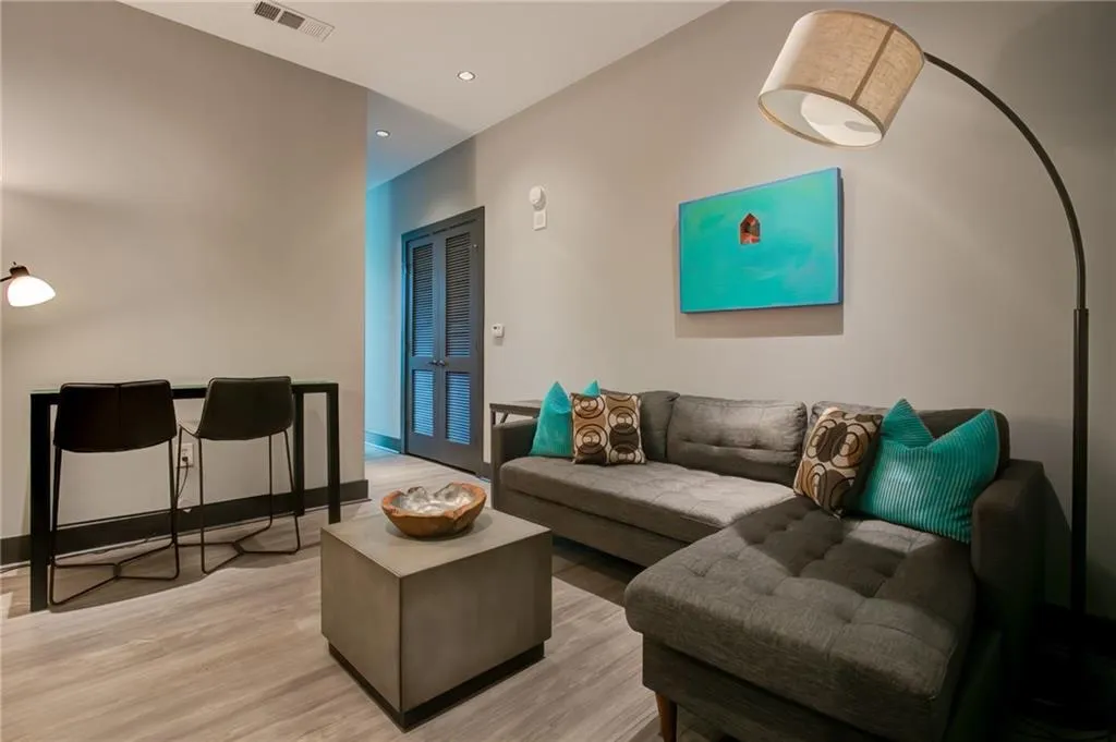 Guest Suite with light wood-style floors and recessed lighting