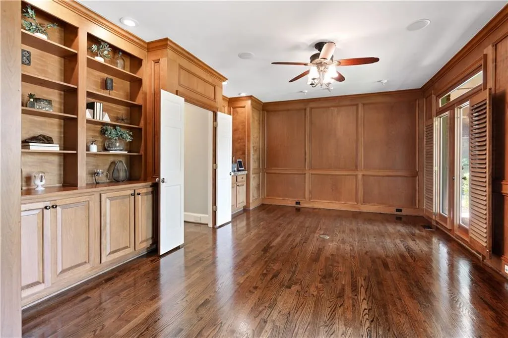 Featuring ceiling fan, built in shelves and wet bar