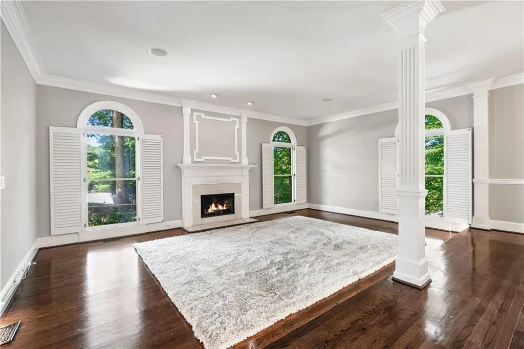 Living room with natural light and tree scape views