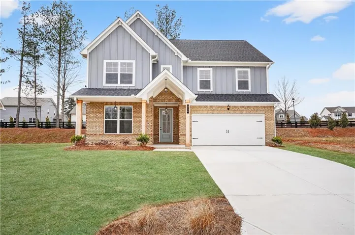 Contemporary two-story exterior with brick and board and batten siding
