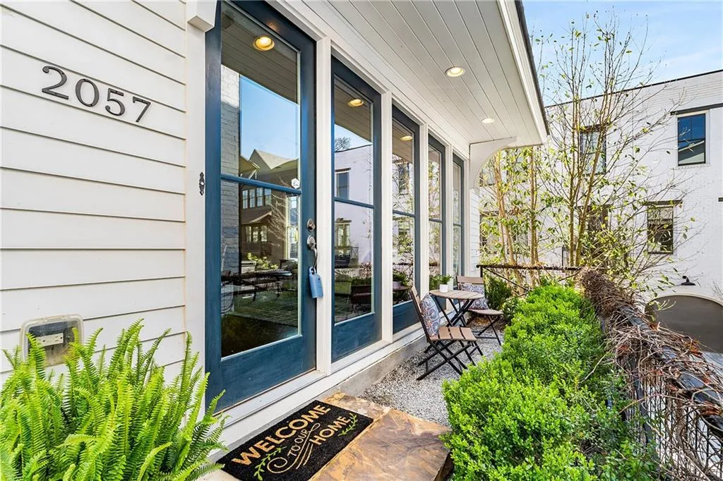 Front porch has a setting area. There is a large court yard right off porch