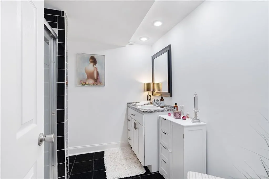 Bathroom with vanity and tile patterned flooring