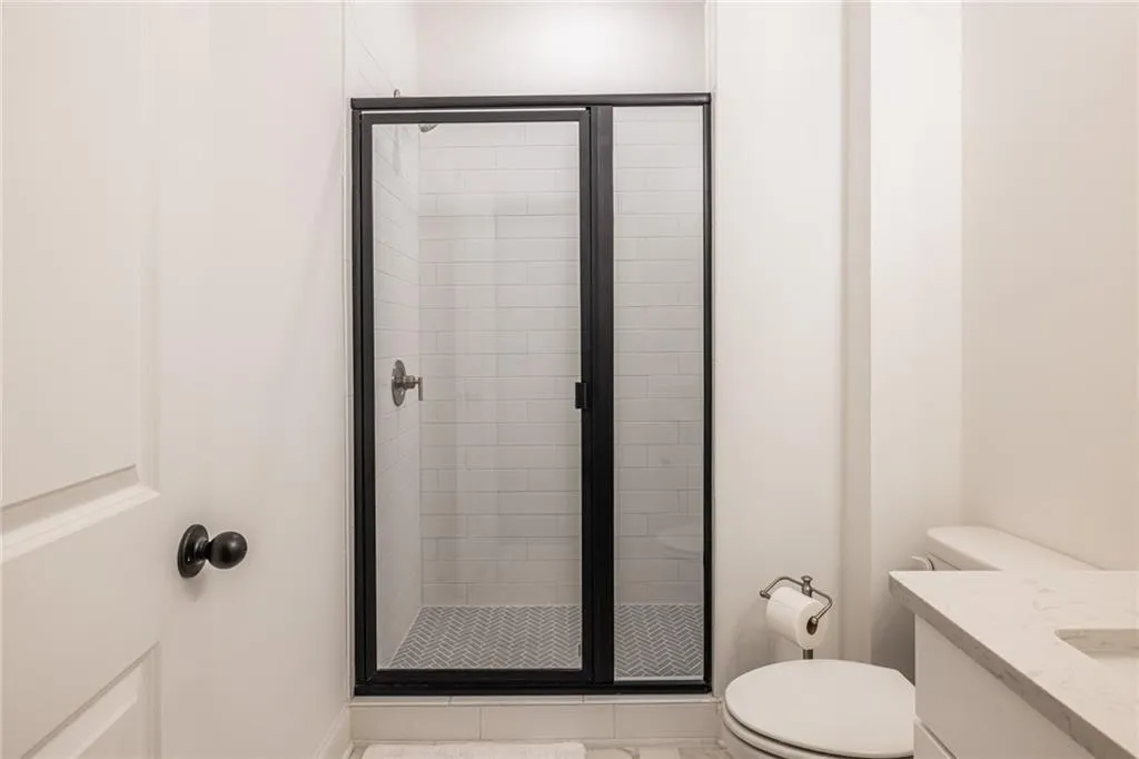 Bathroom with a shower stall and vanity
