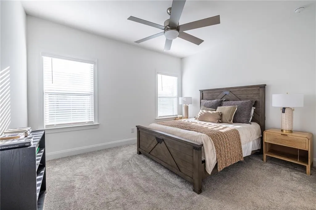 Bedroom featuring carpet floors and ceiling fan