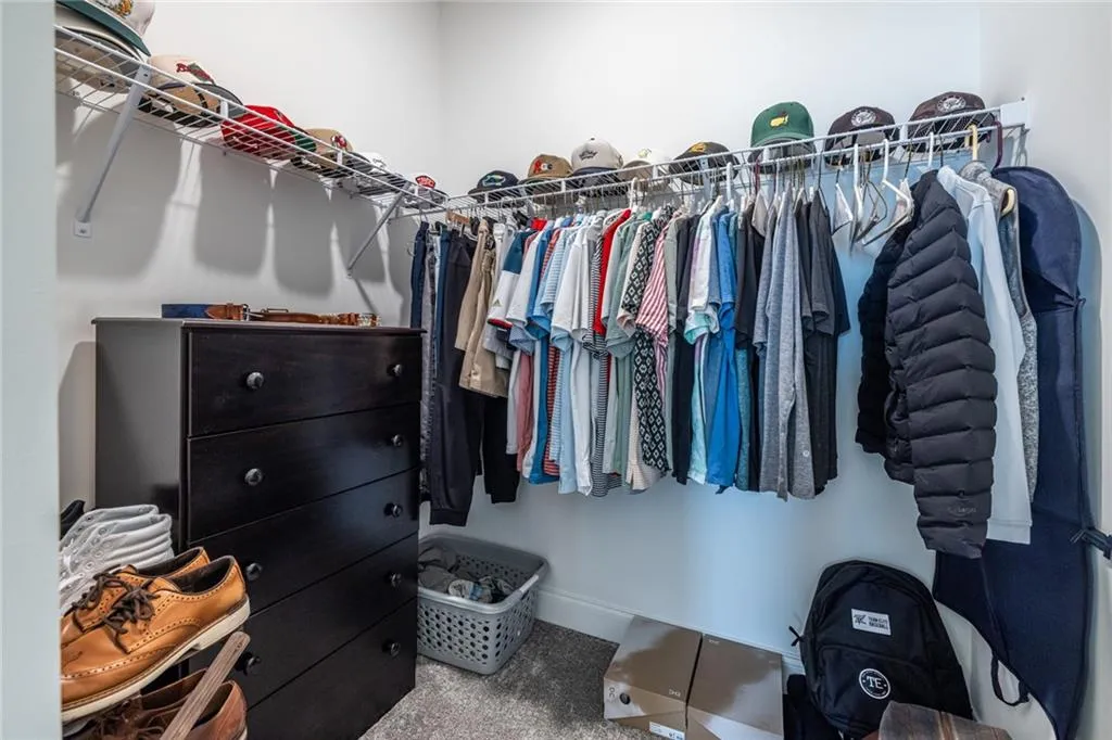 Spacious closet with carpet flooring