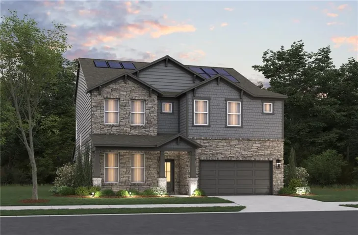 Contemporary two-story residence featuring a stone and shingle facade, an attached two-car garage, solar panels, and a covered front entry