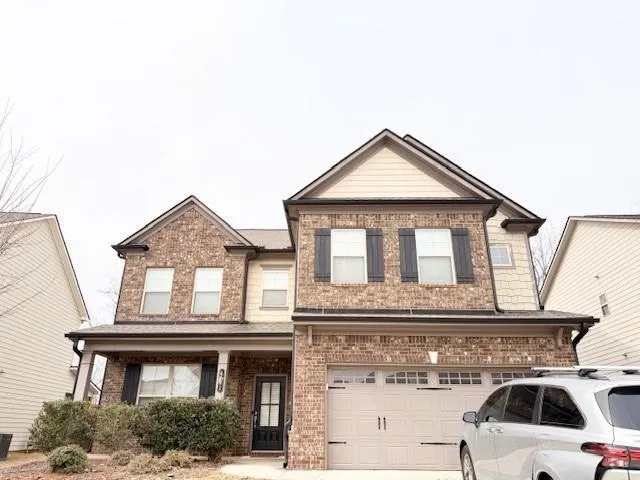 Brick and siding facade with gabled roof lines