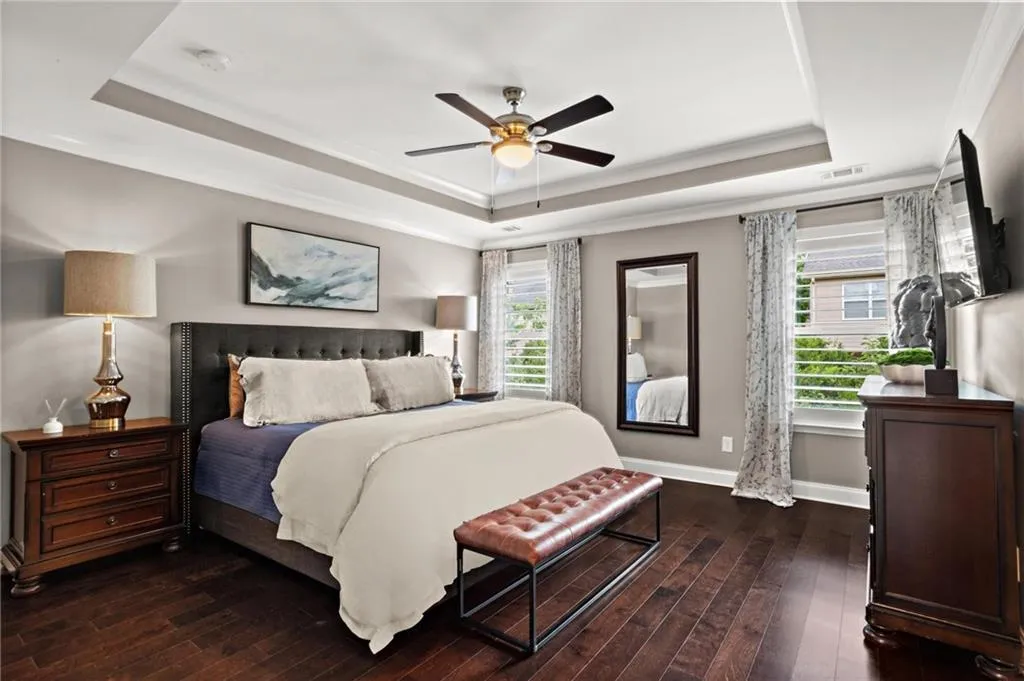 The primary suite does not disappoint ideally situated on the back of the home