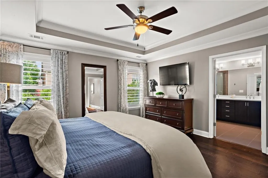The bedroom flows seamlessly into the primary bathroom