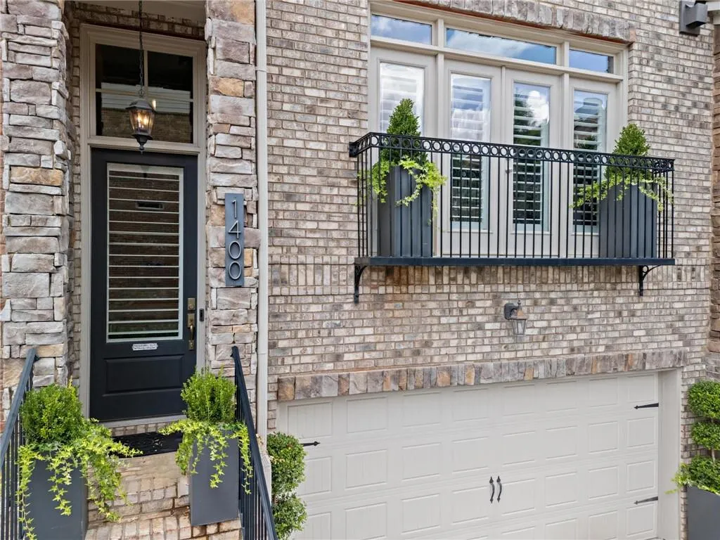 Welcoming Entry complimented by Juliet Balcony, there is even have a custom window box to accent this balconette