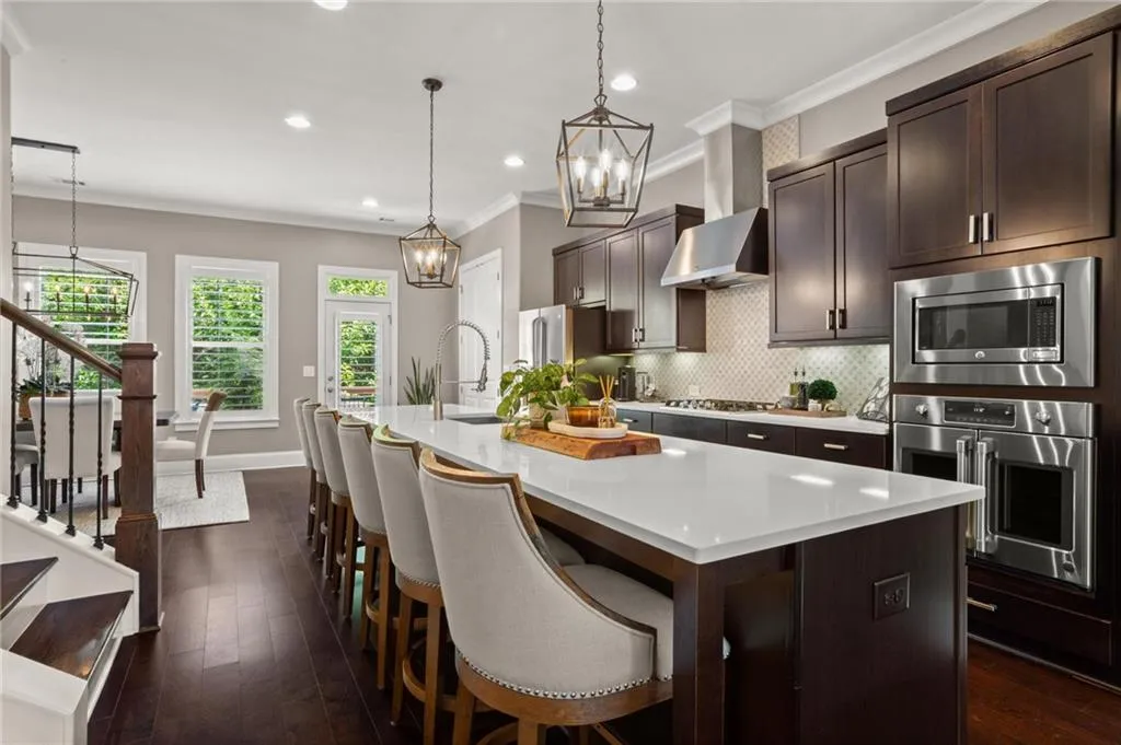 The oversized island offers prep space for the chef and ideal gathering space for friends