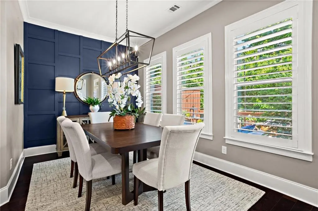 The dining room is filled with natural light and situated ideally between the kicthen and back deck