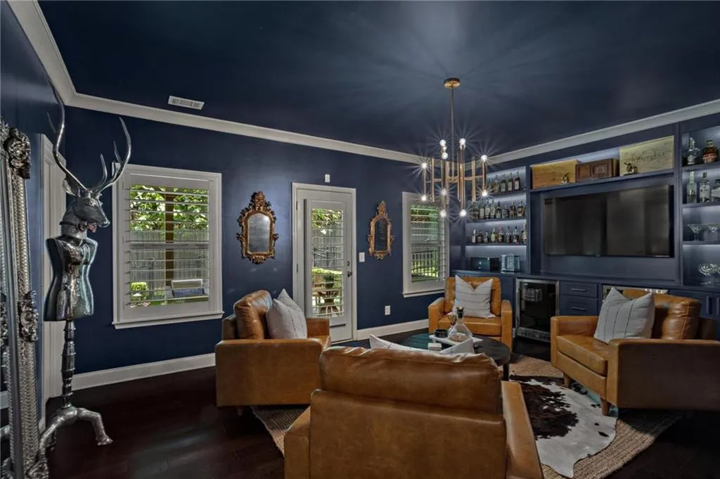 Terrace level bedroom is currently used as a wine room complete with custom built ins