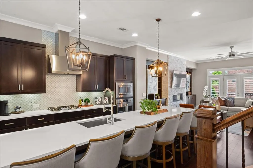 The attention to detail and upgrades throughout standout against the warmth of the stained shaker style cabinetry