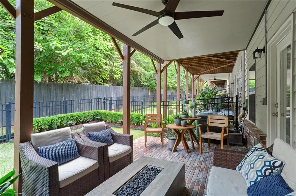 The terrace level flows onto this welcoming outdoor terrace complete with custom brick pavers offering an additional seating area