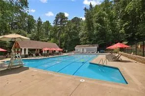 Community pool featuring a patio