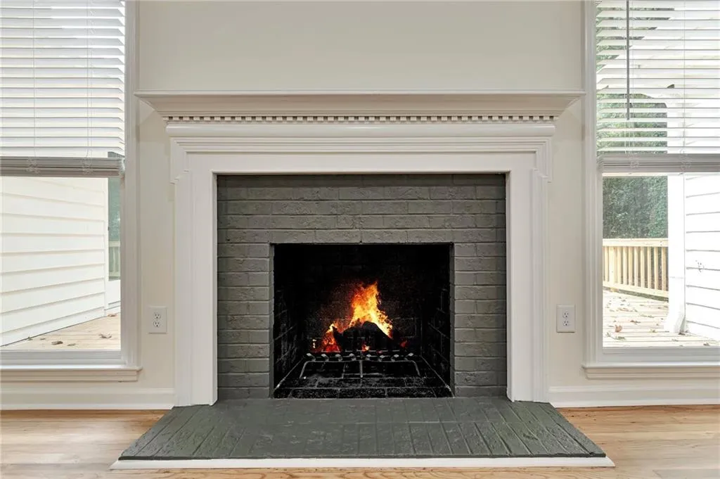 Details featuring a fireplace and hardwood / wood-style floors