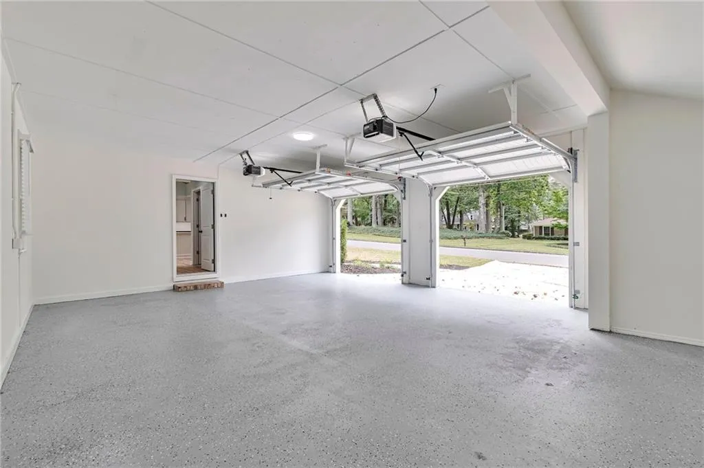 Garage featuring a garage door opener