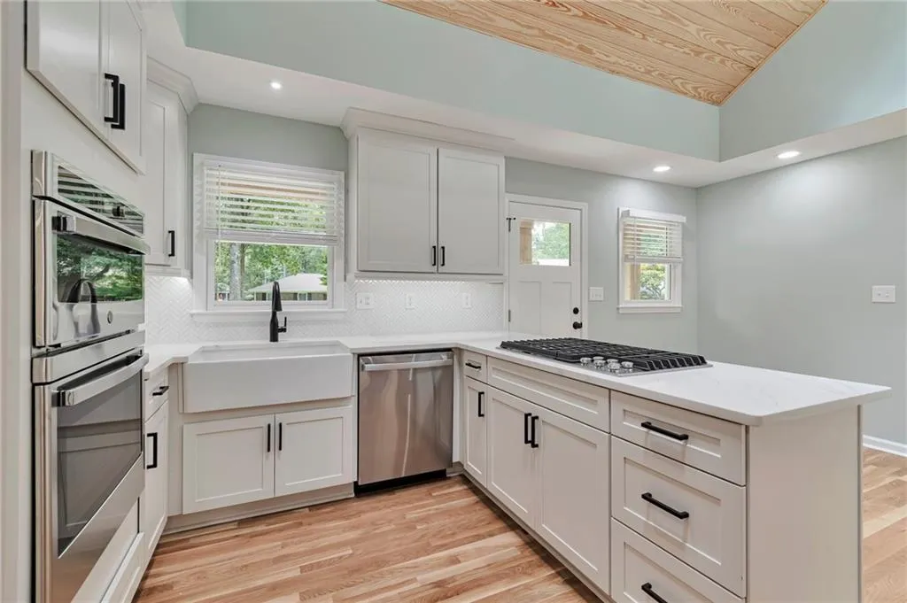 Kitchen featuring plenty of natural light, sink, light hardwood / wood-style flooring, and appliances with stainless steel finishes