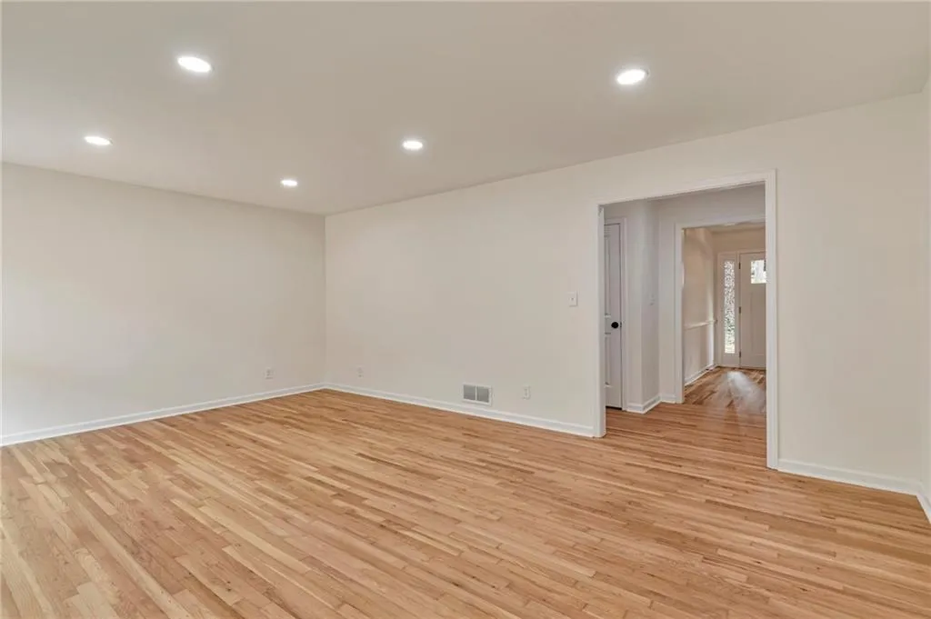 Unfurnished room featuring light wood-type flooring