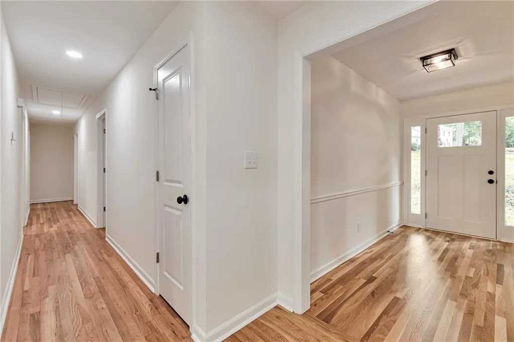 Foyer with light hardwood / wood-style flooring