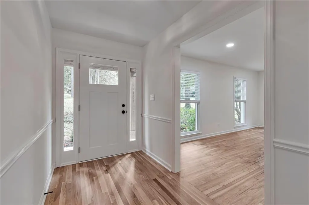 Entrance foyer featuring light wood-type flooring and a wealth of natural light