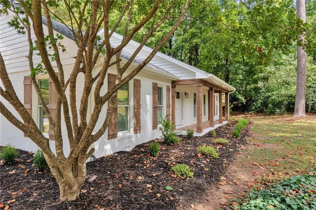 View of property exterior featuring a porch