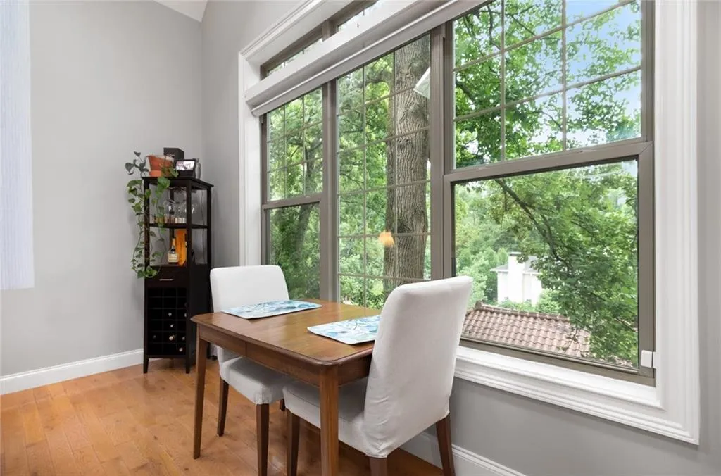 Dining space featuring light wood-style floors and an office area