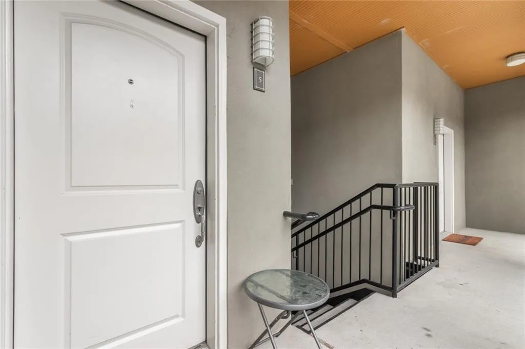 Property entrance featuring stucco siding