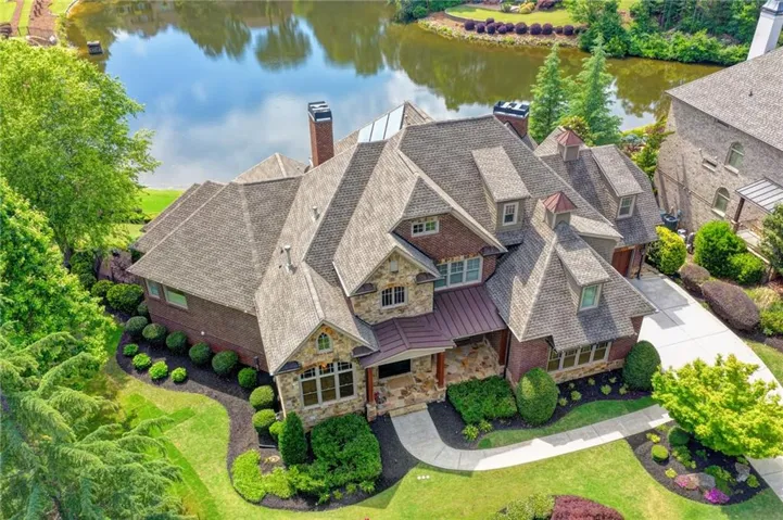 Stone and brick facade residence with a multi-gabled roofline