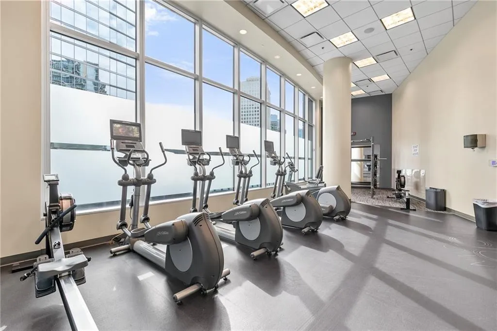 Fitness center with expansive window-walls and durable flooring