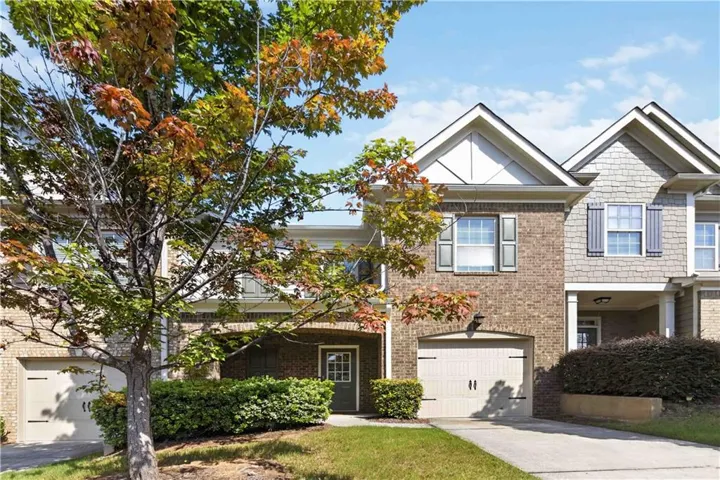Brick and shingle exterior with gabled roof lines